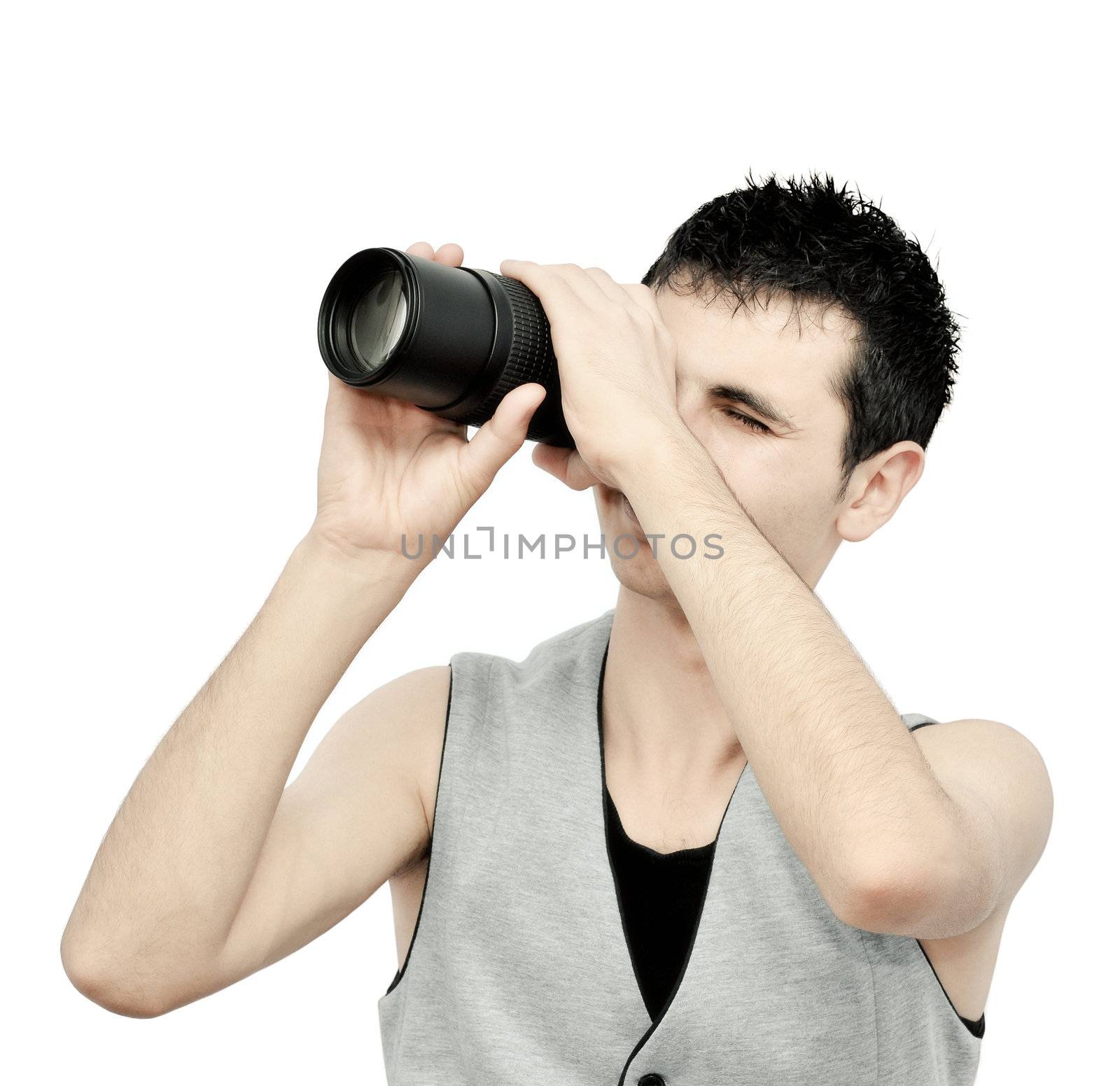 Young man looking through the lens