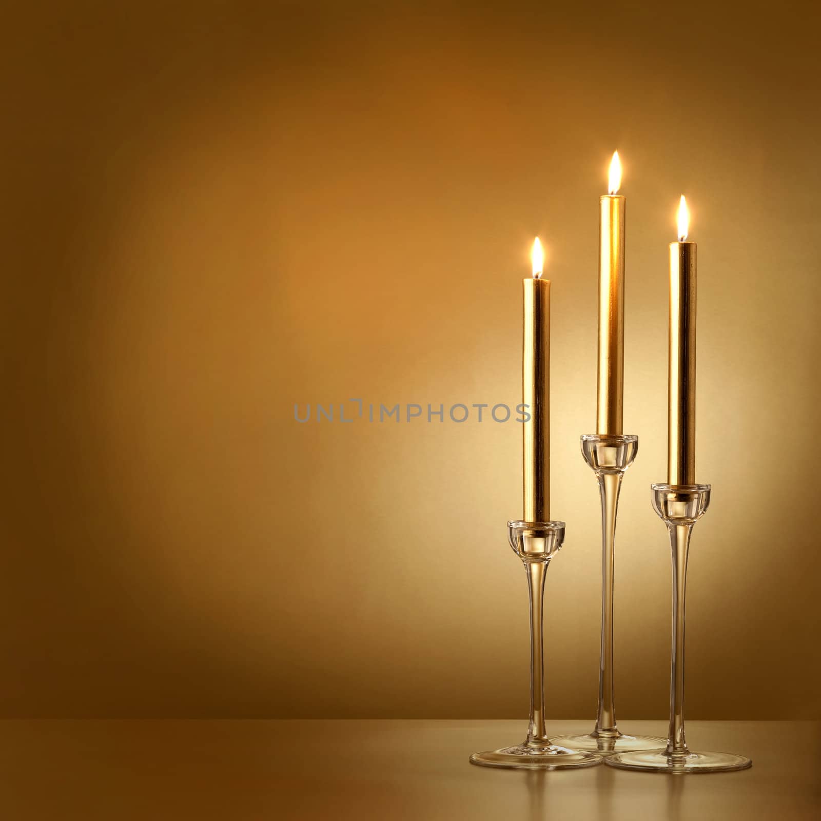 three gold candles