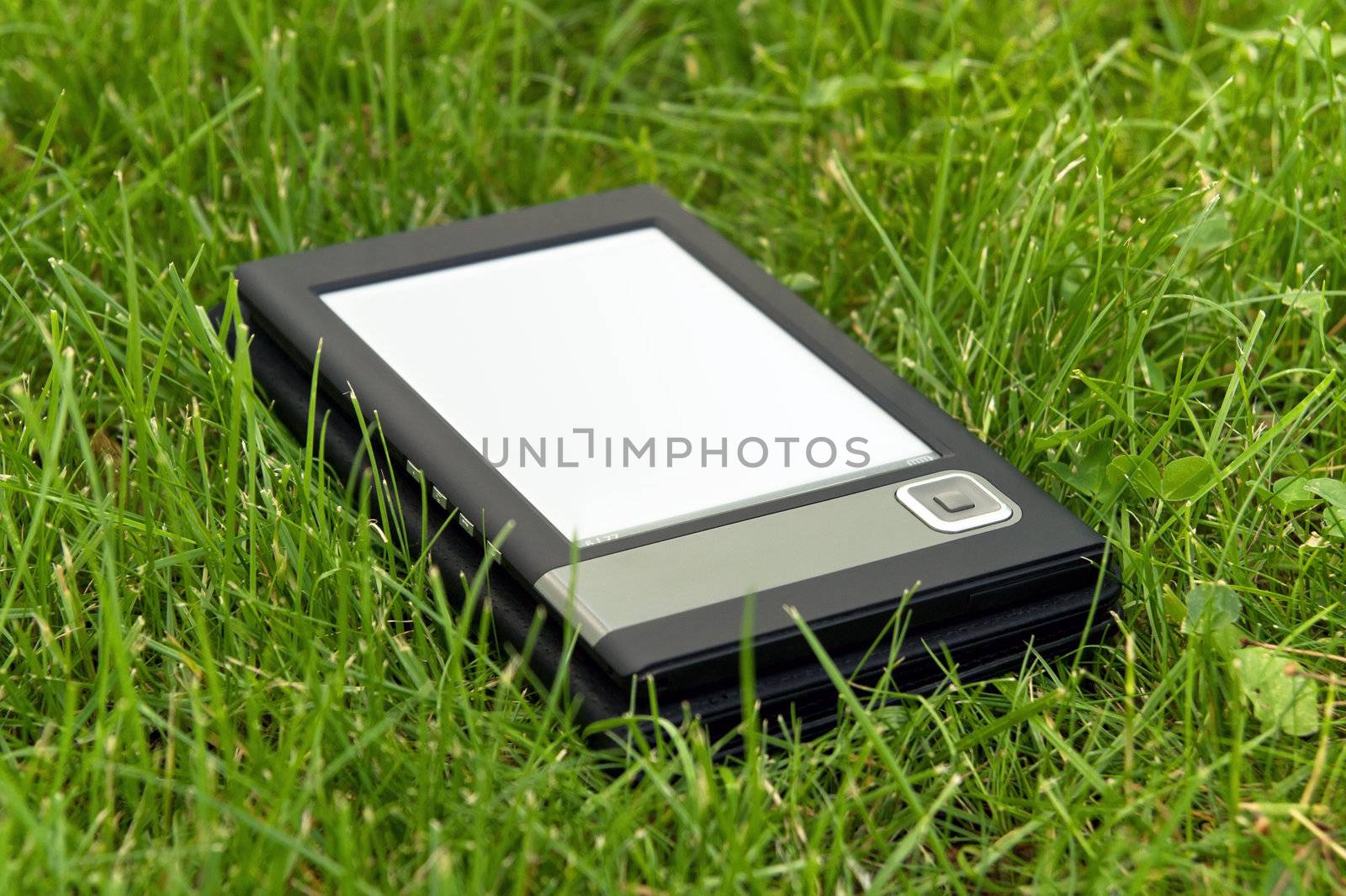 E-Book Reader in the grass by bloomua
