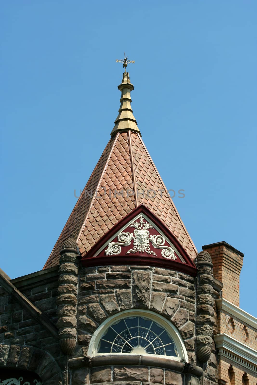 A Weather vane on top of an old building