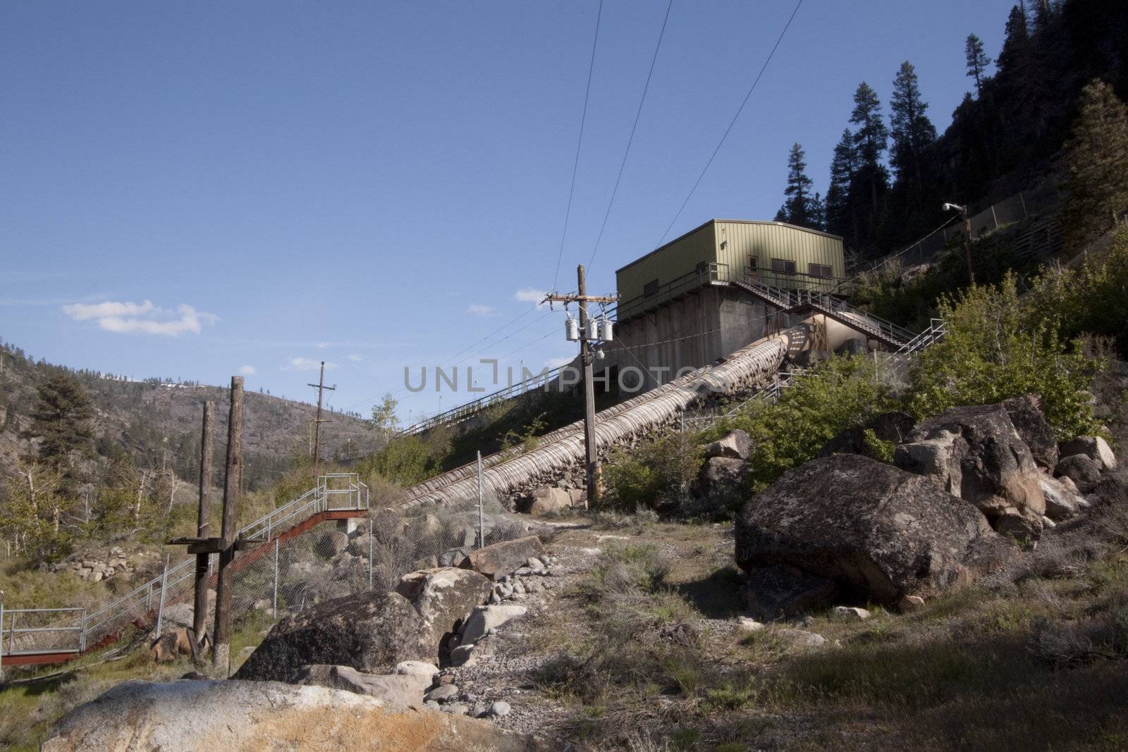 a power plant next to the river in the middle of the forest powe by jeremywhat