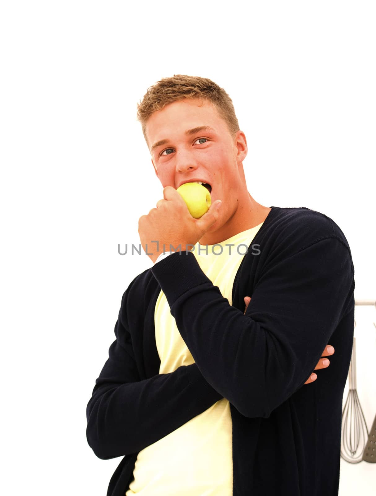 handsome young man eating an apple  by karinclaus