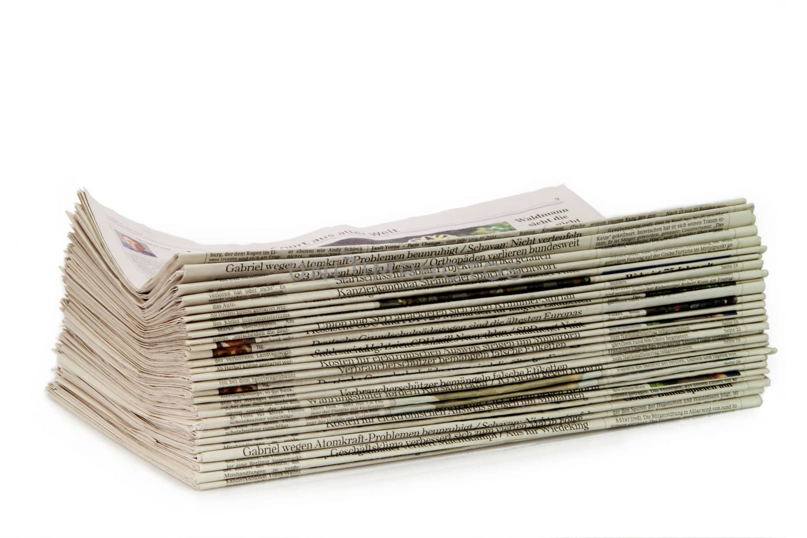 Newspaper stack on white background