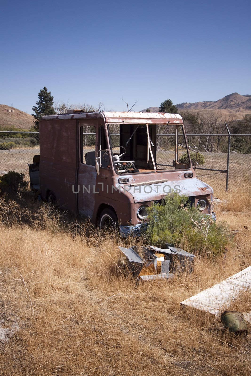 An old rusty abandoned car.