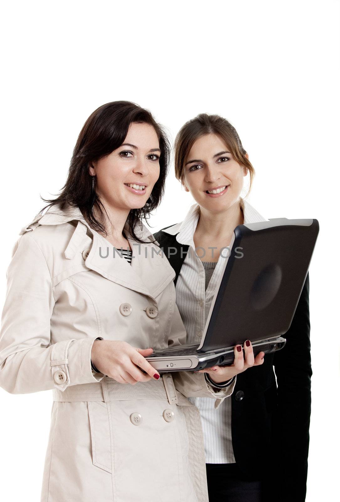 Two female young students watching something on a laptop