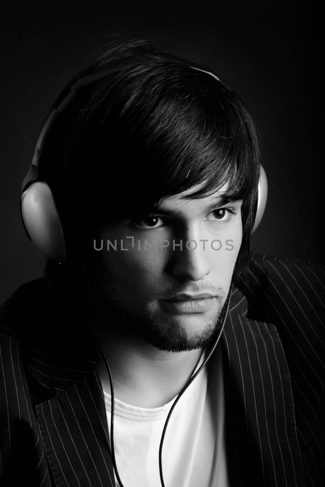 Young Man listening to music with headphones