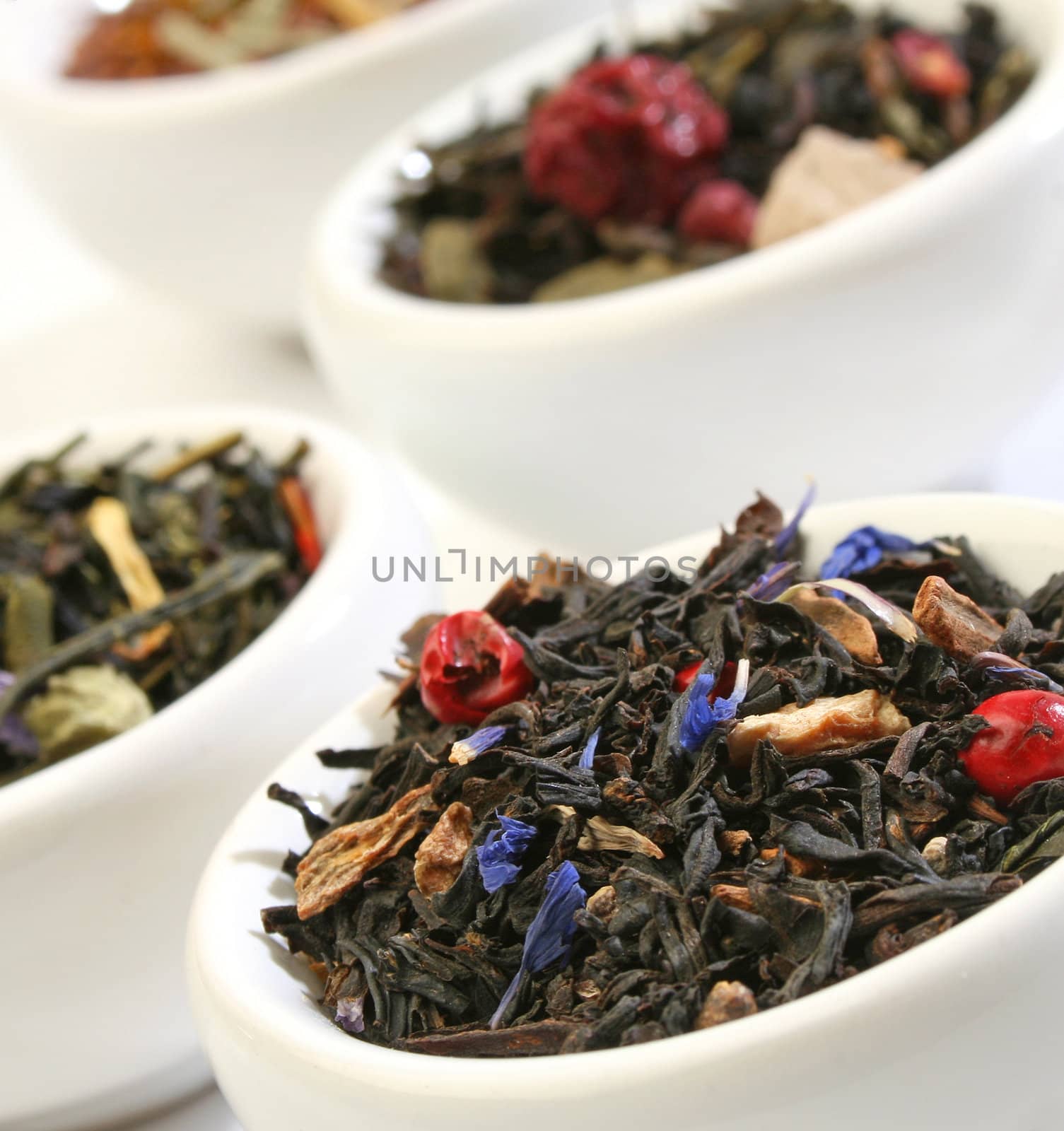 Various bowls of premiun tea leaves blends by Erdosain
