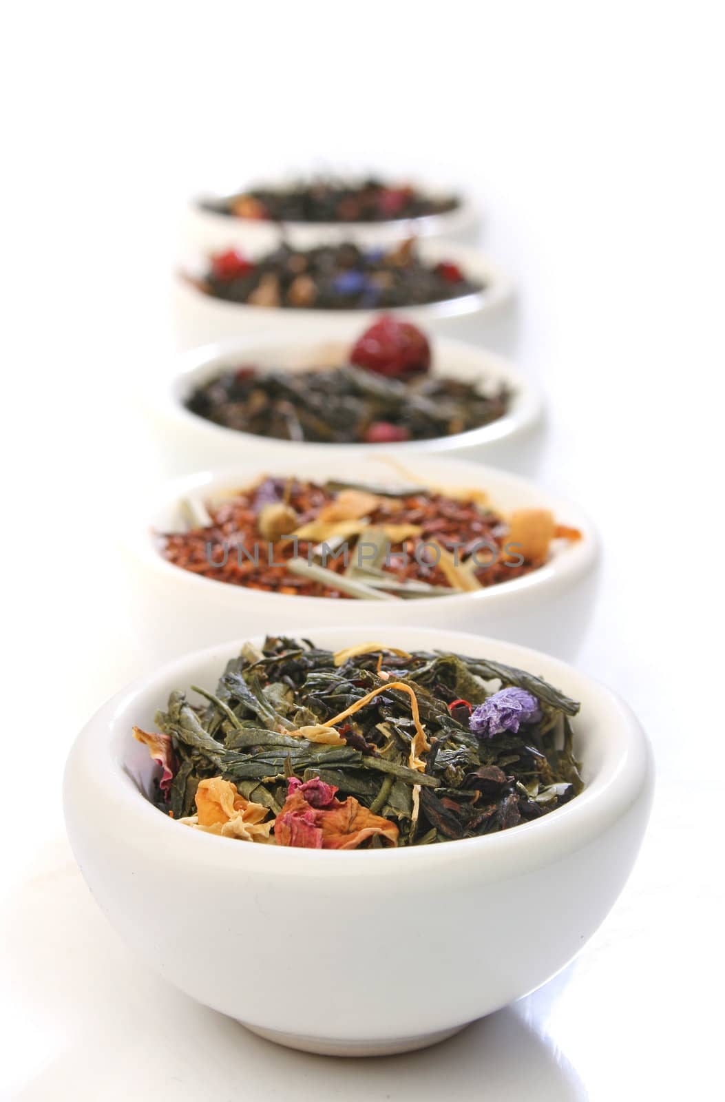 Various bowls of premiun tea leaves blends by Erdosain