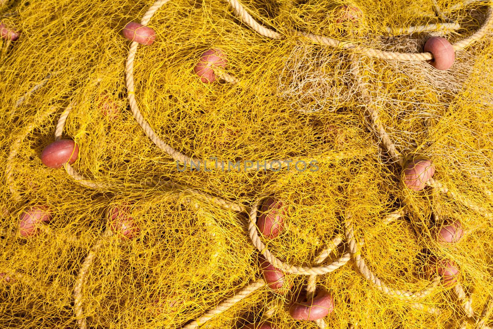 Pile yellow fishing net background texture pattern.