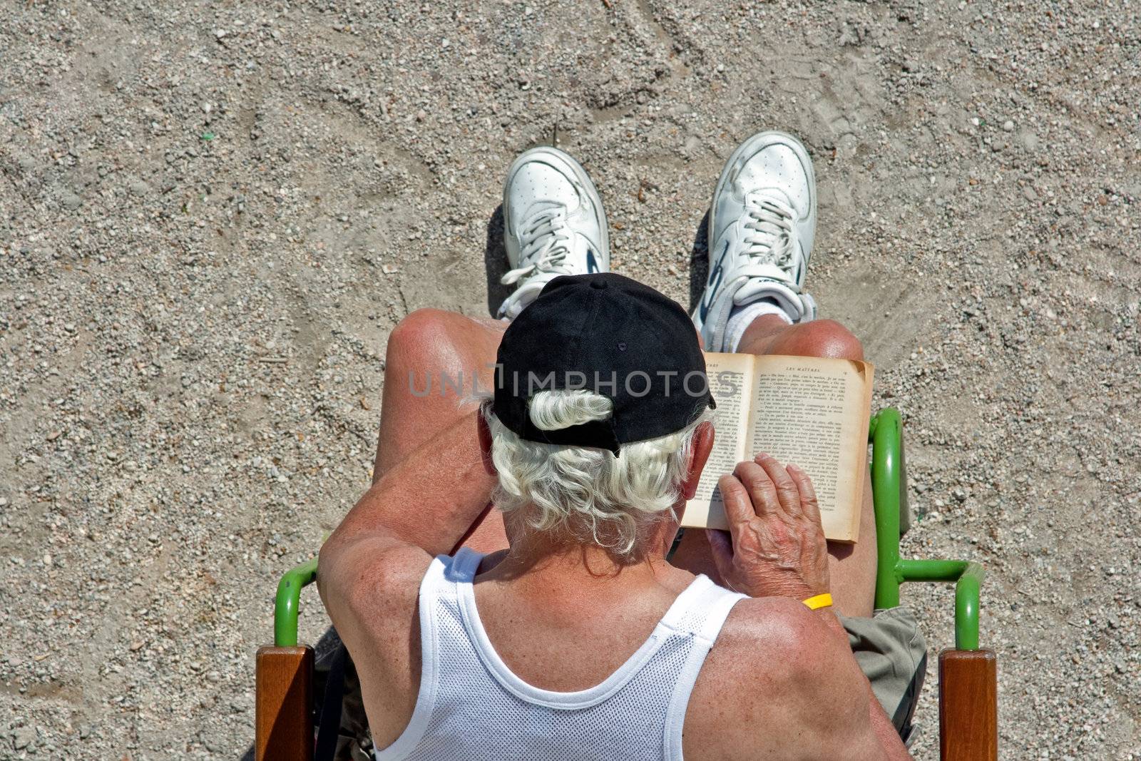 Retired man relaxing in Paris at the Tuileries Garden