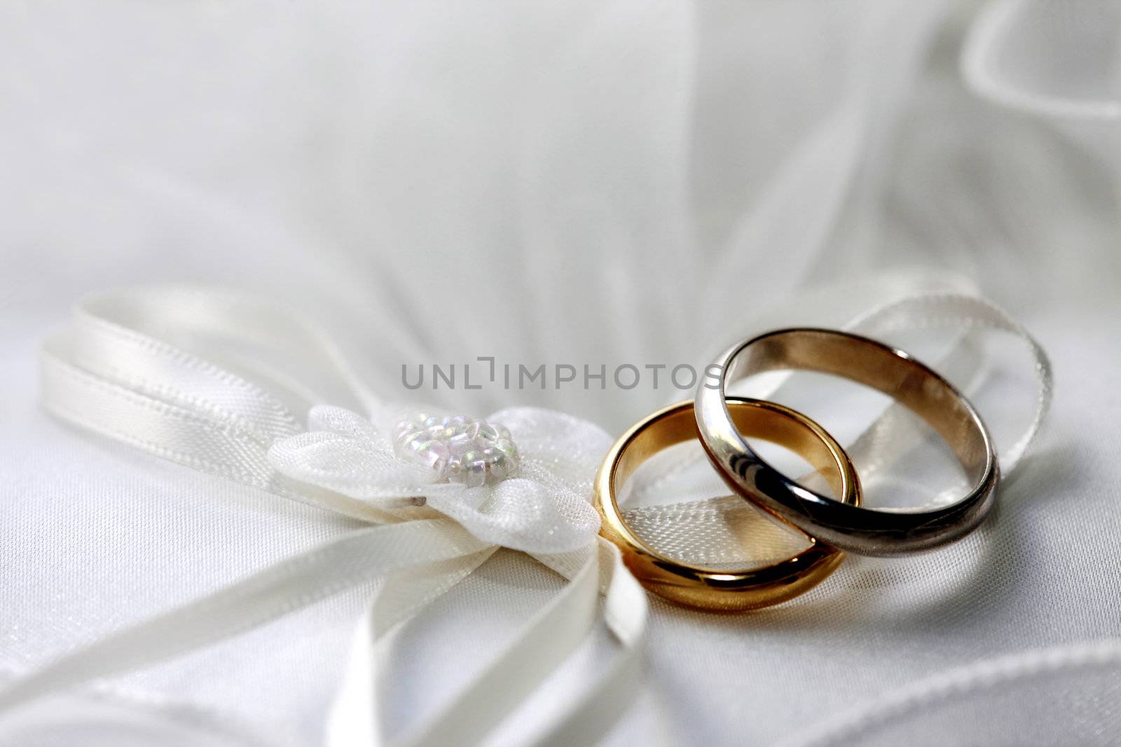 Wedding rings on a satiny fabric