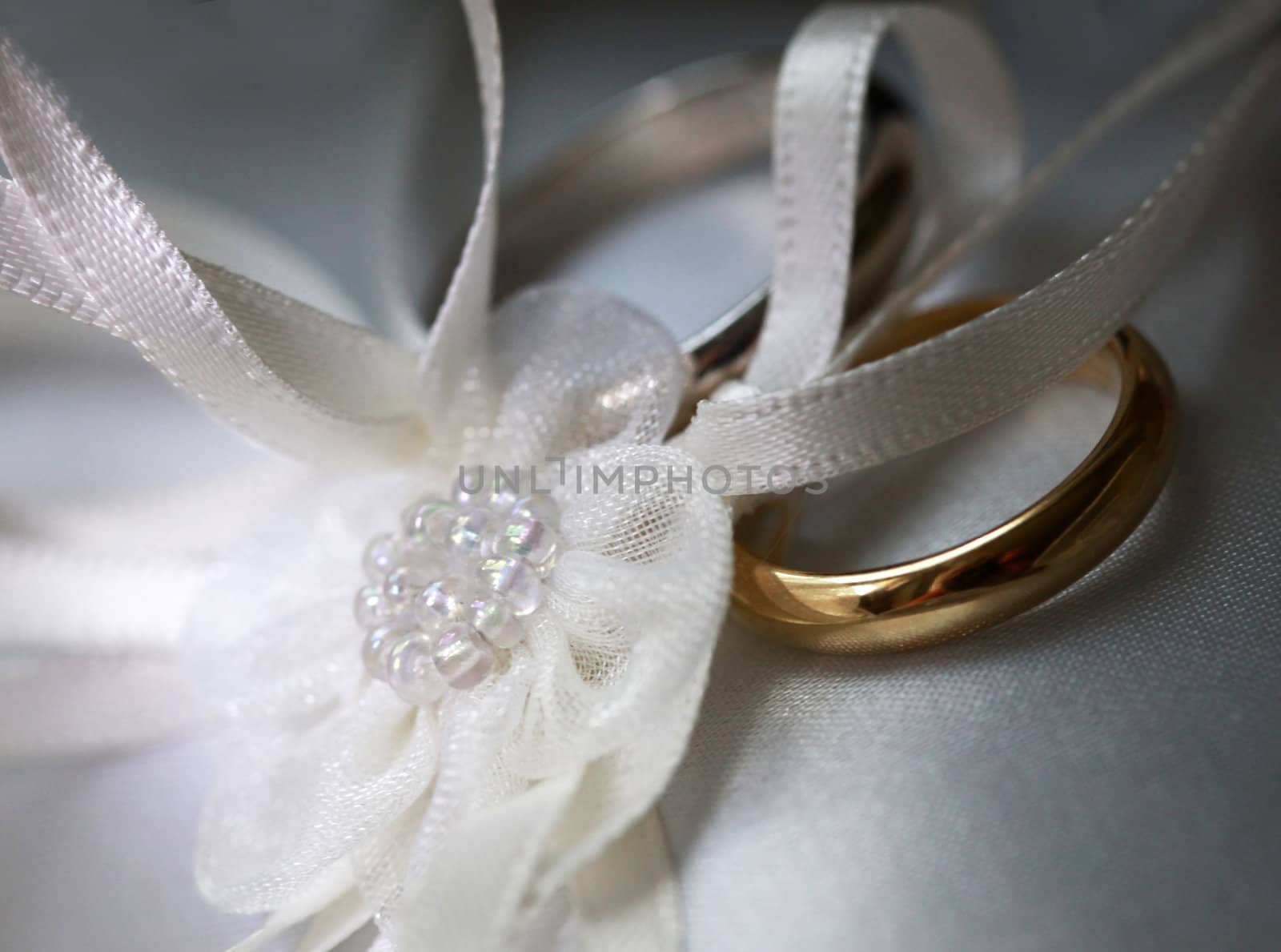 Wedding rings on a satiny fabric