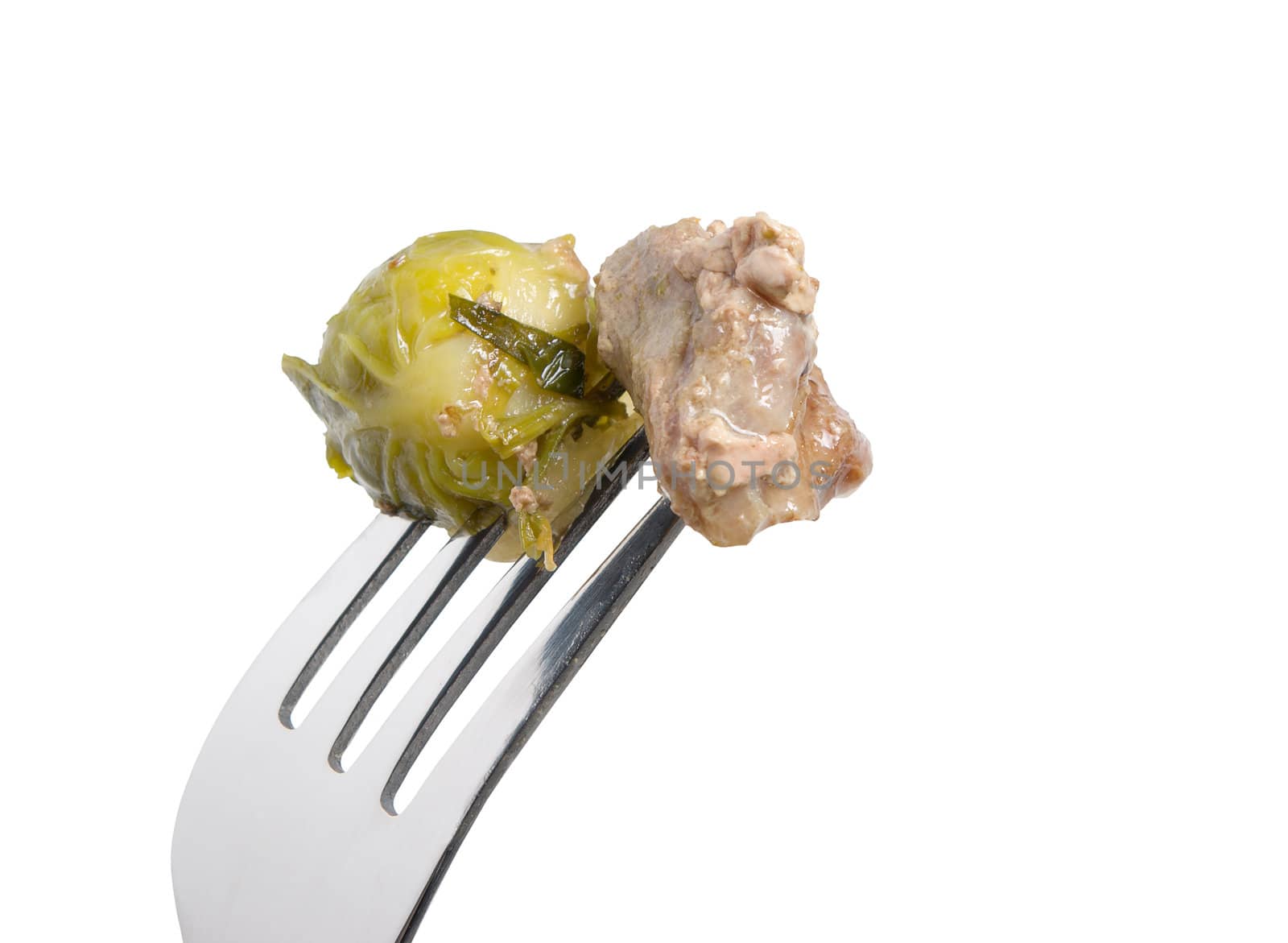 Meat and brussels sprouts on fork.a white background