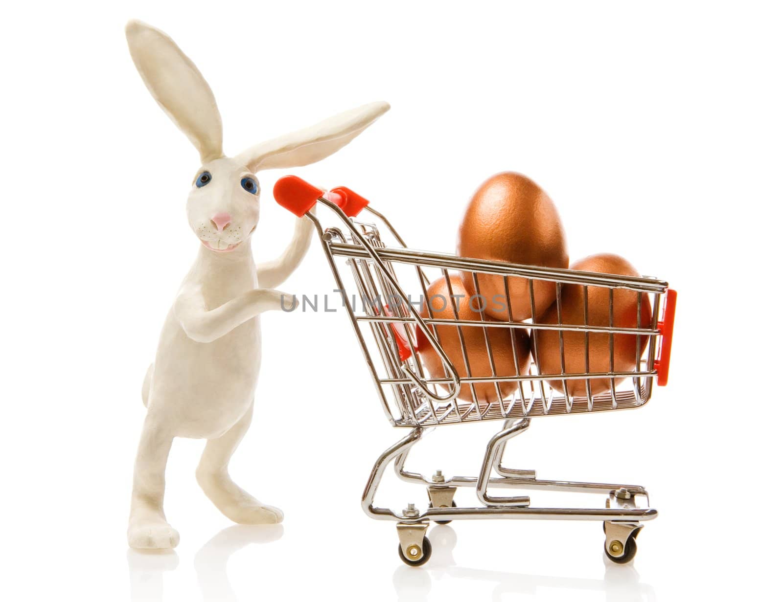 Easter rabbit carries the cart with gold eggs
