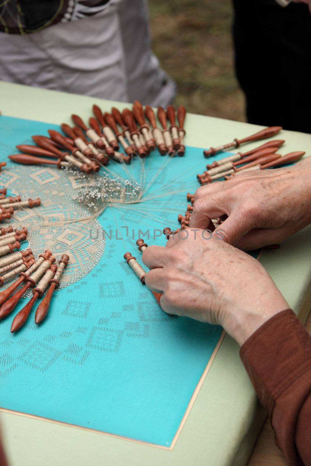 Process of lace-making with bobbins  by jp_chretien