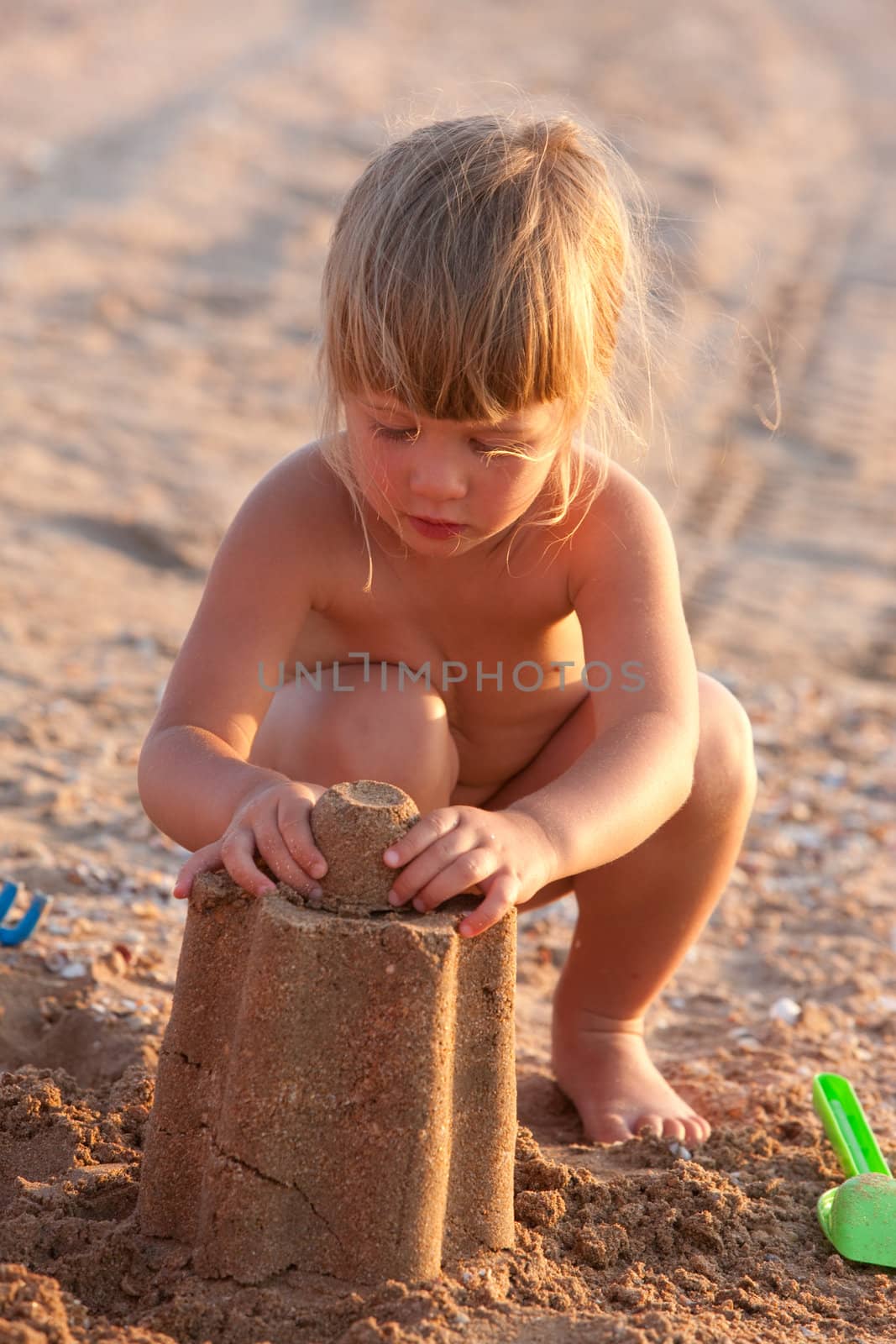 people series: little girl on the beach play with sand