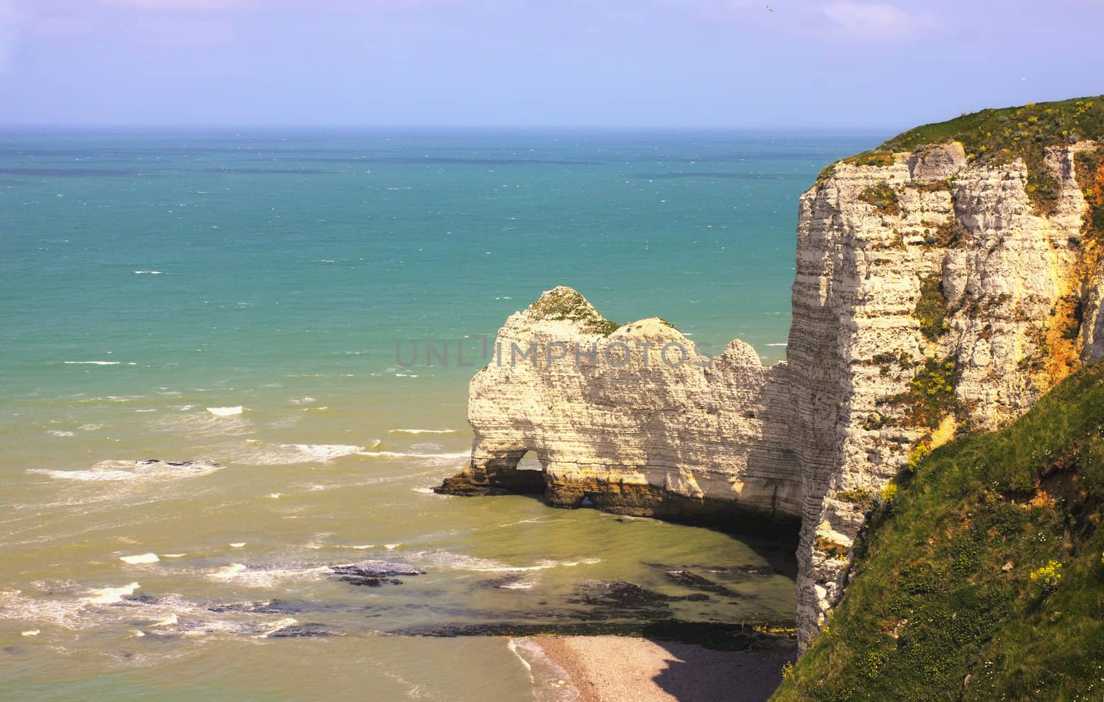 Beach with cliff Falaise d'Aval. Normandy, Cote d'Albatre, France. 