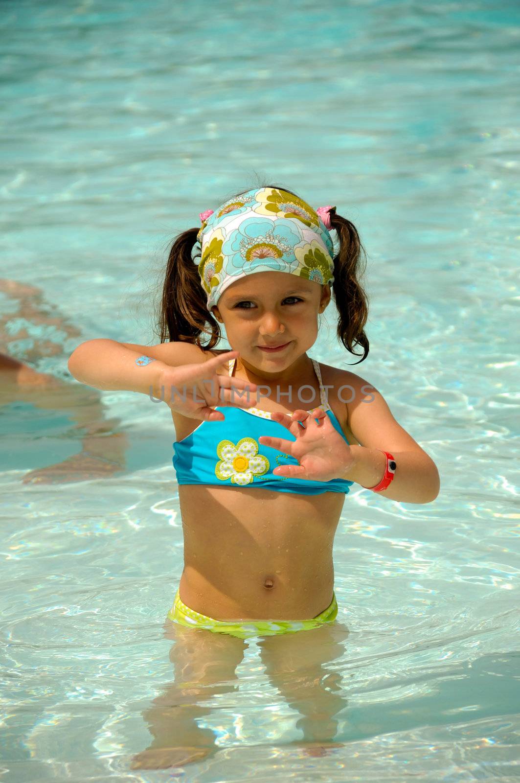 Child in pool by cfoto