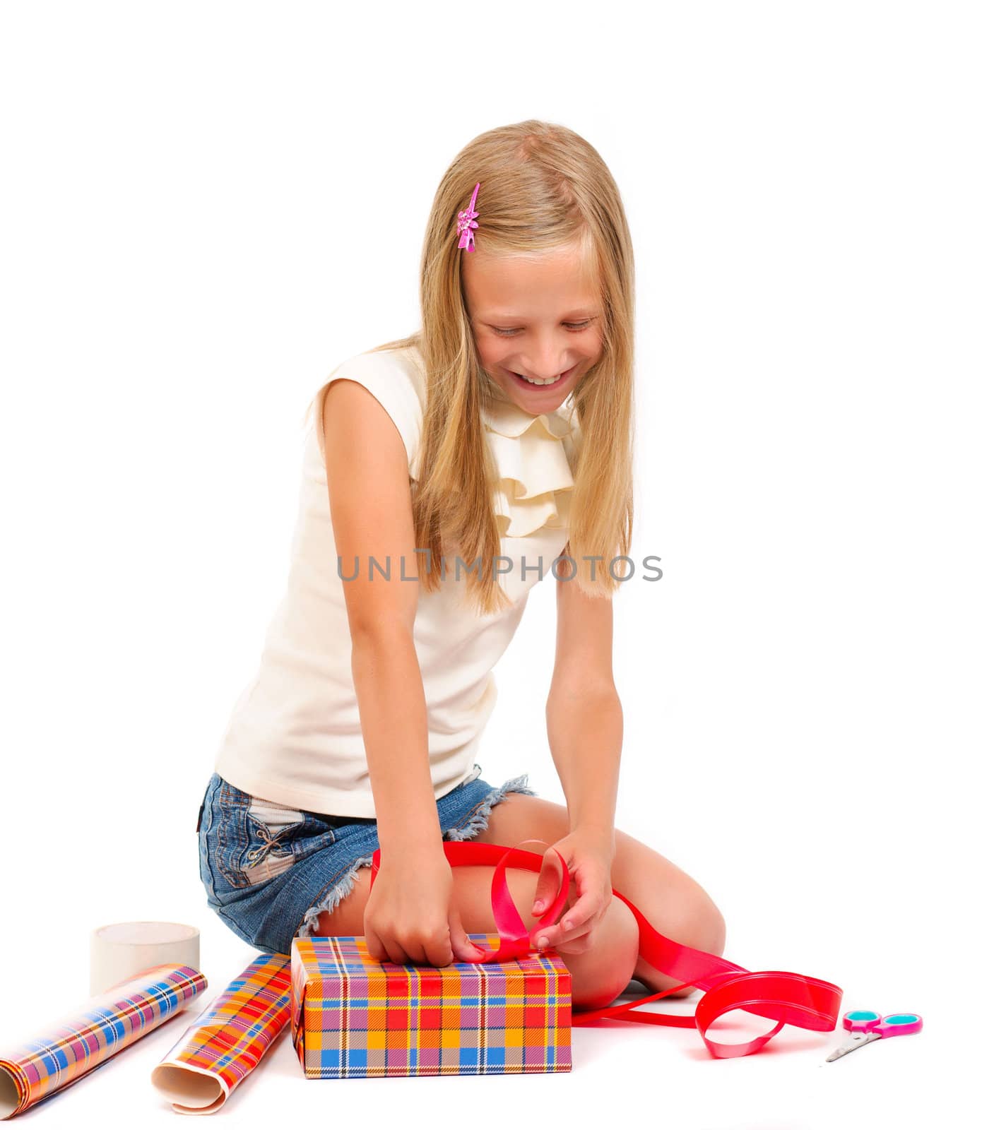 Girl makes a gift on a white background isolated