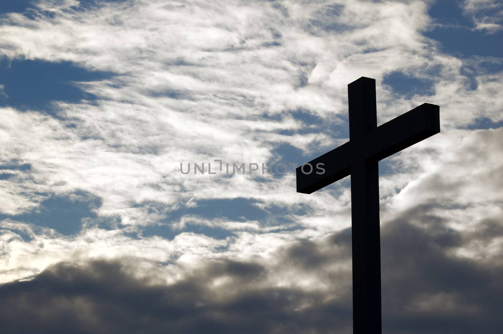 A cross in the cloud sky