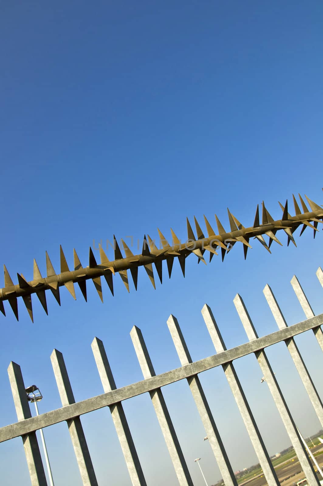 Barbed wire fence at the blue sky. metaphor of freedom and incarceration