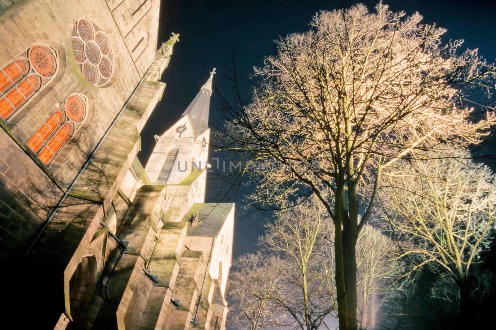 Large stone church at night by PiLens
