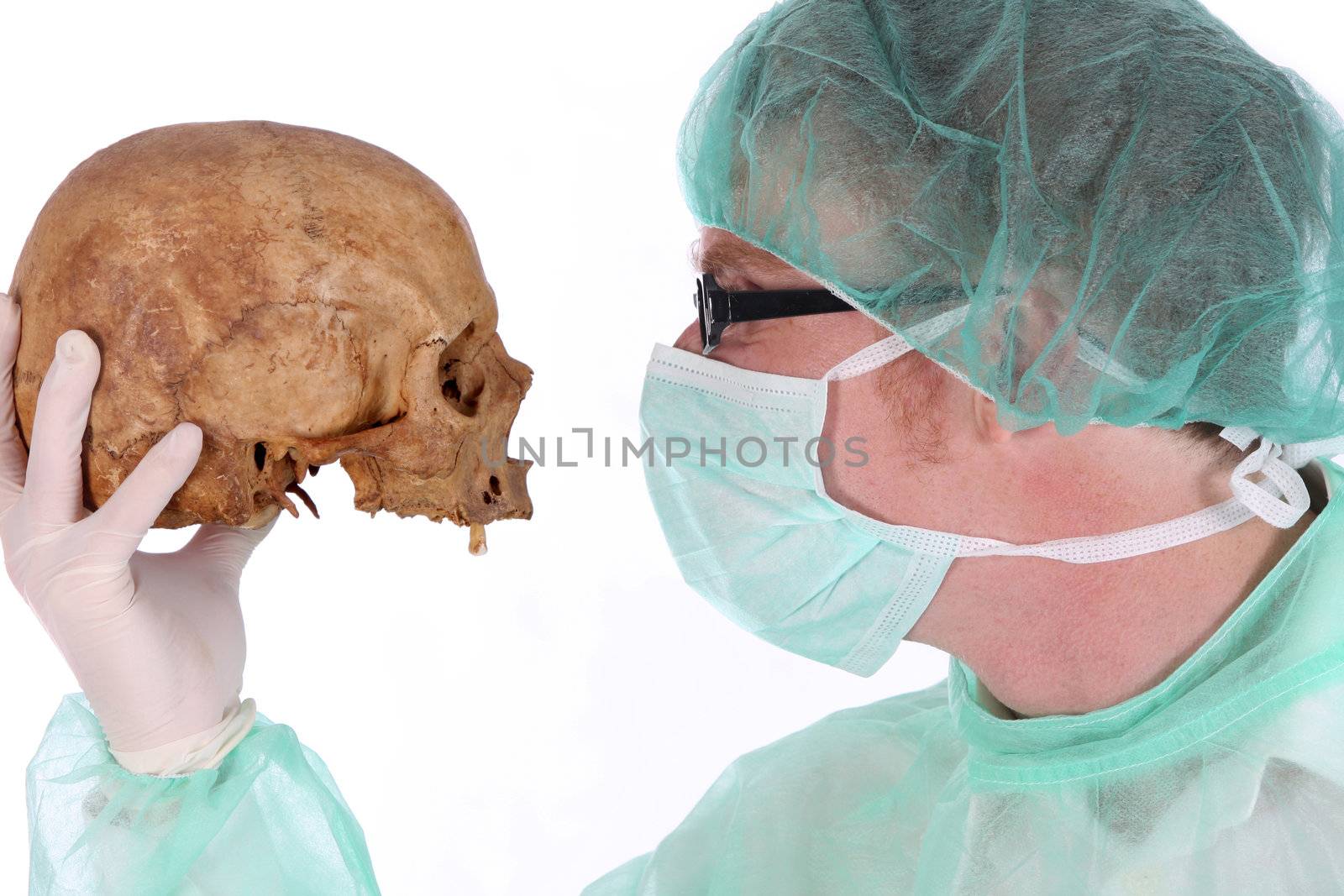 Details surgeon with skull on white background