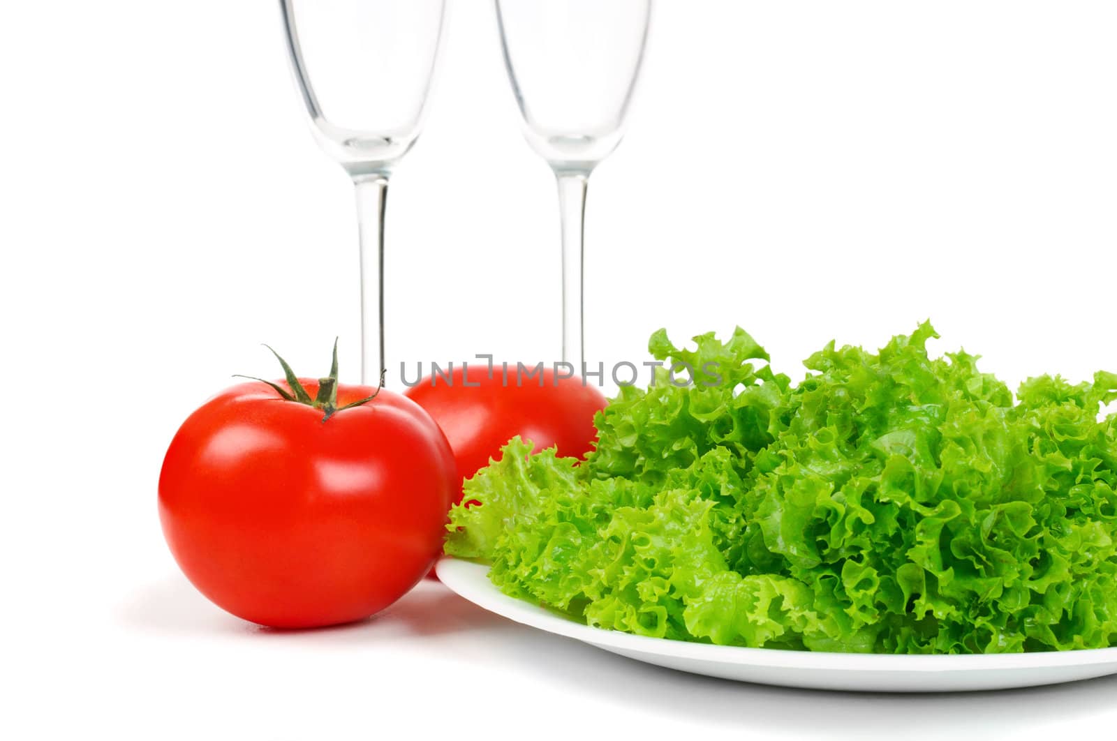 Leaves lettuce and tomato on white background