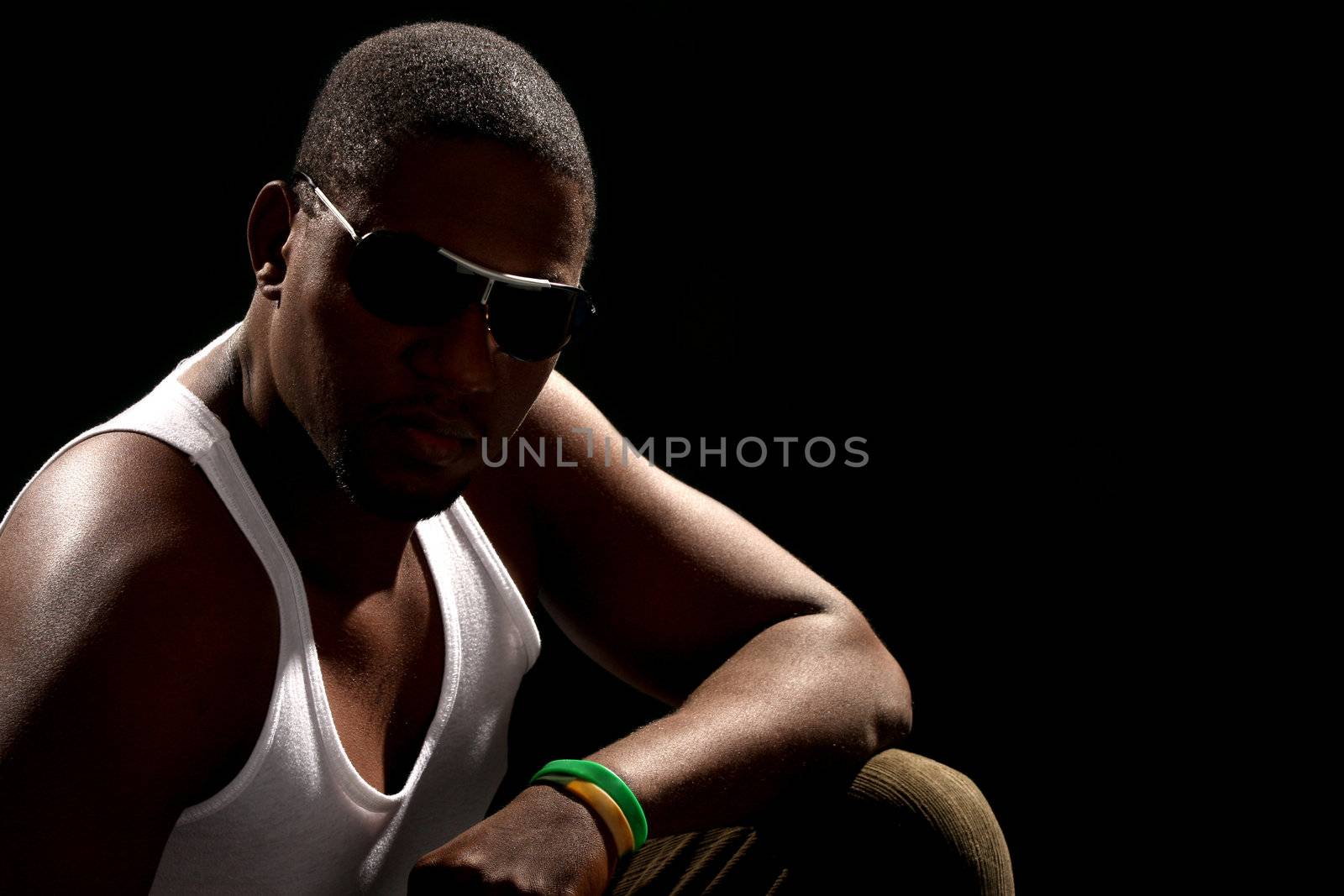 Young african american male on black background