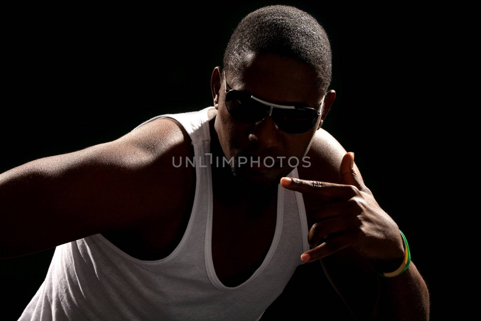 Young african american male on black background