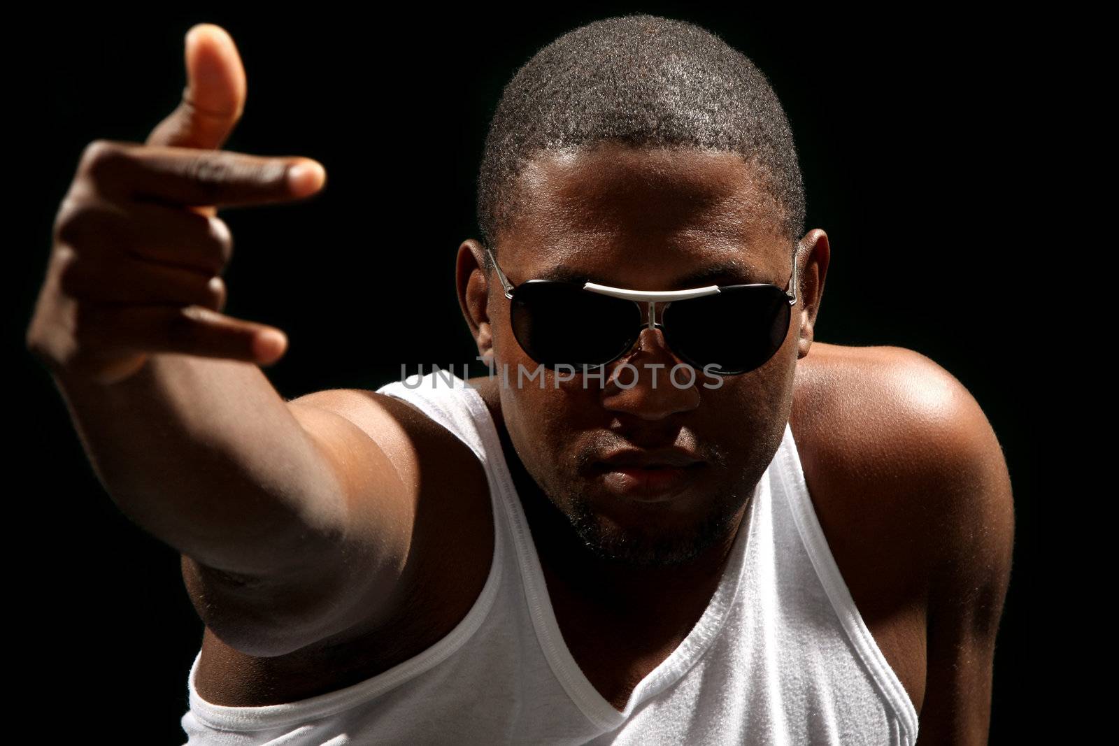 Young african american male on black background