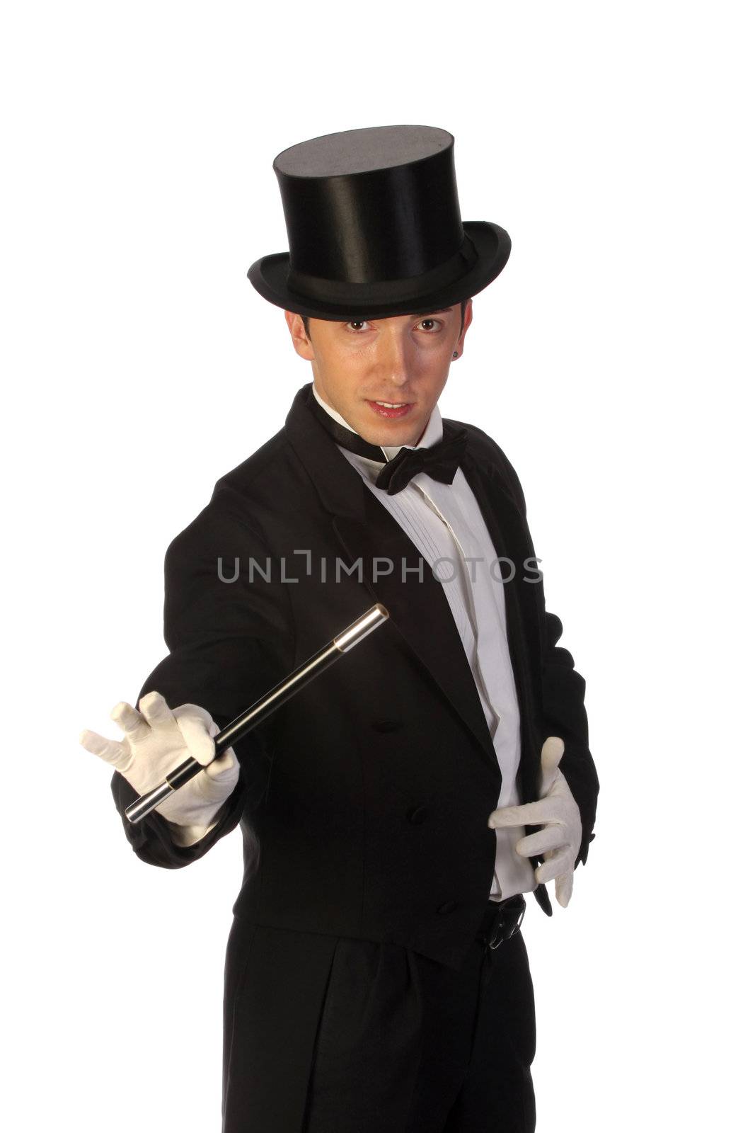 young magician performing with wand on white background