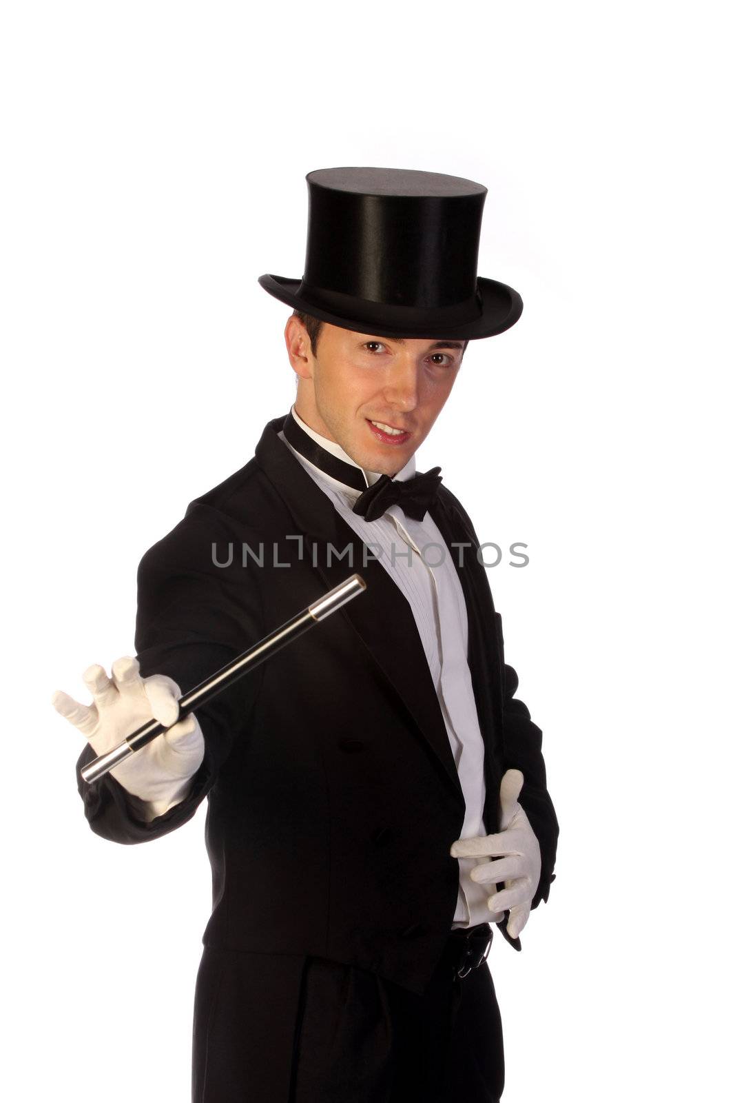 young magician performing with wand on white background