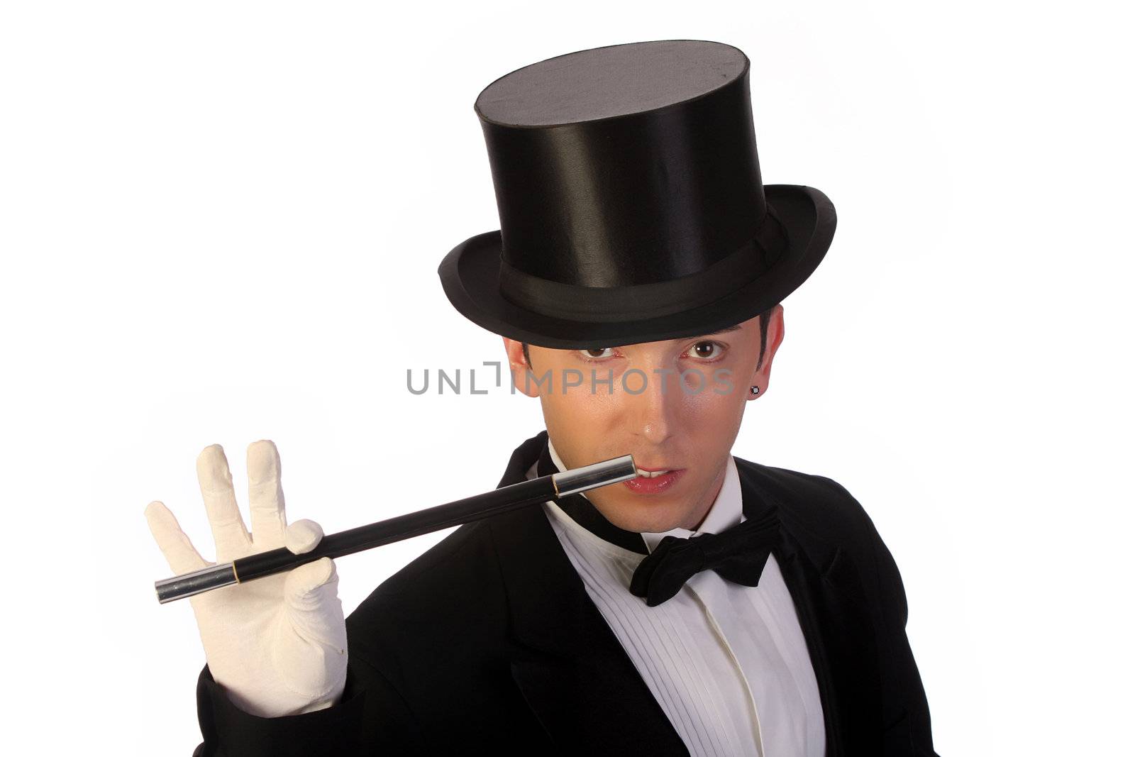 young magician performing with wand on white background