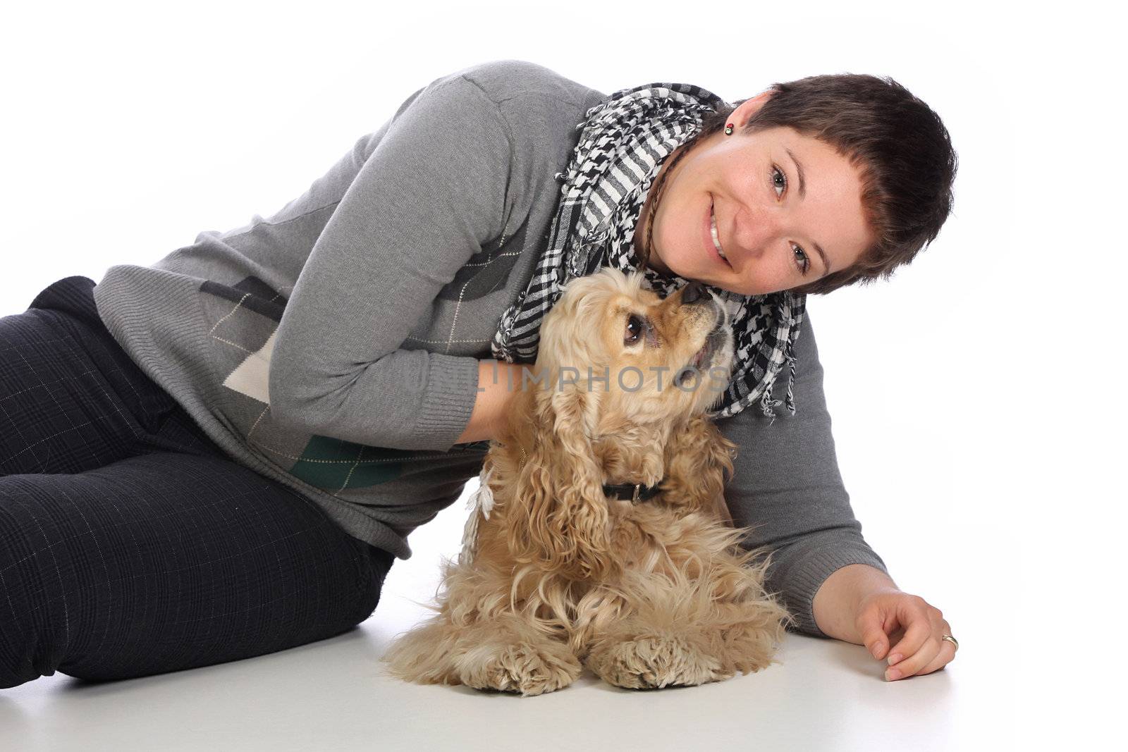 Girl and american cocker spaniel over a white background