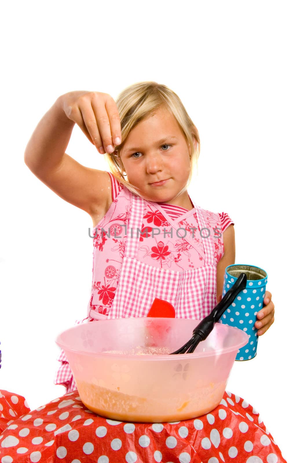 girl is making pancake dough isolated on white 

