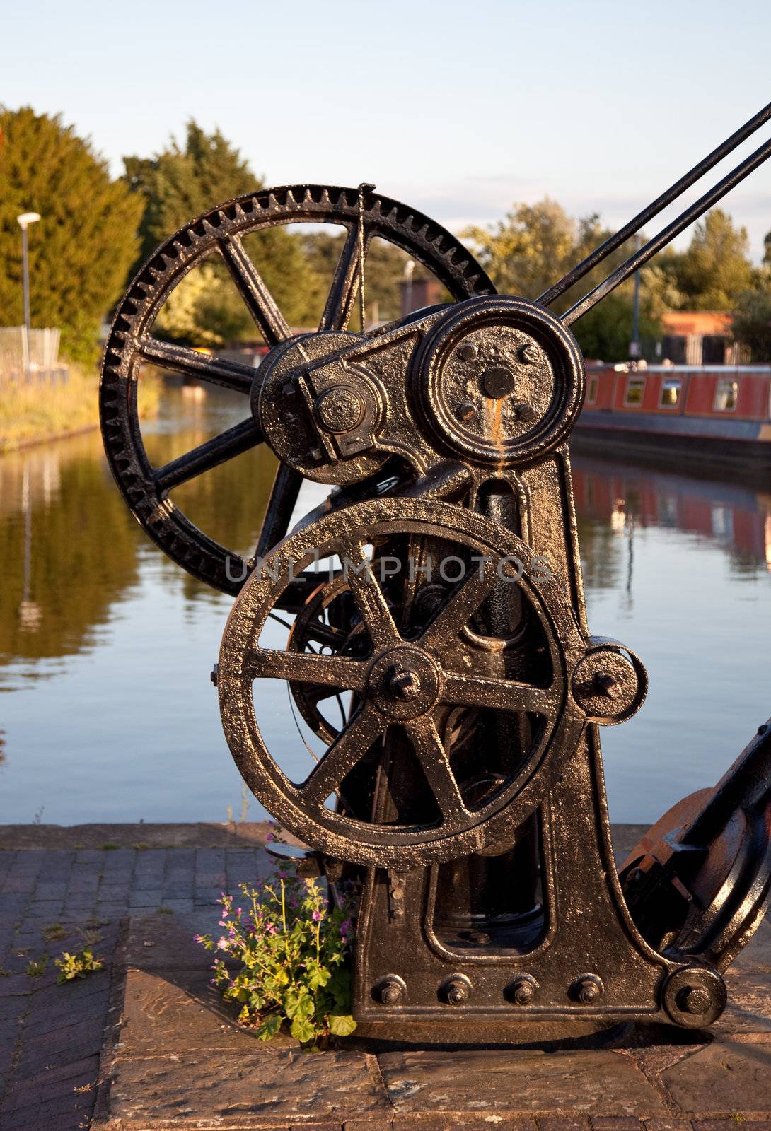 Black steel crane by the waterside in Shropshire