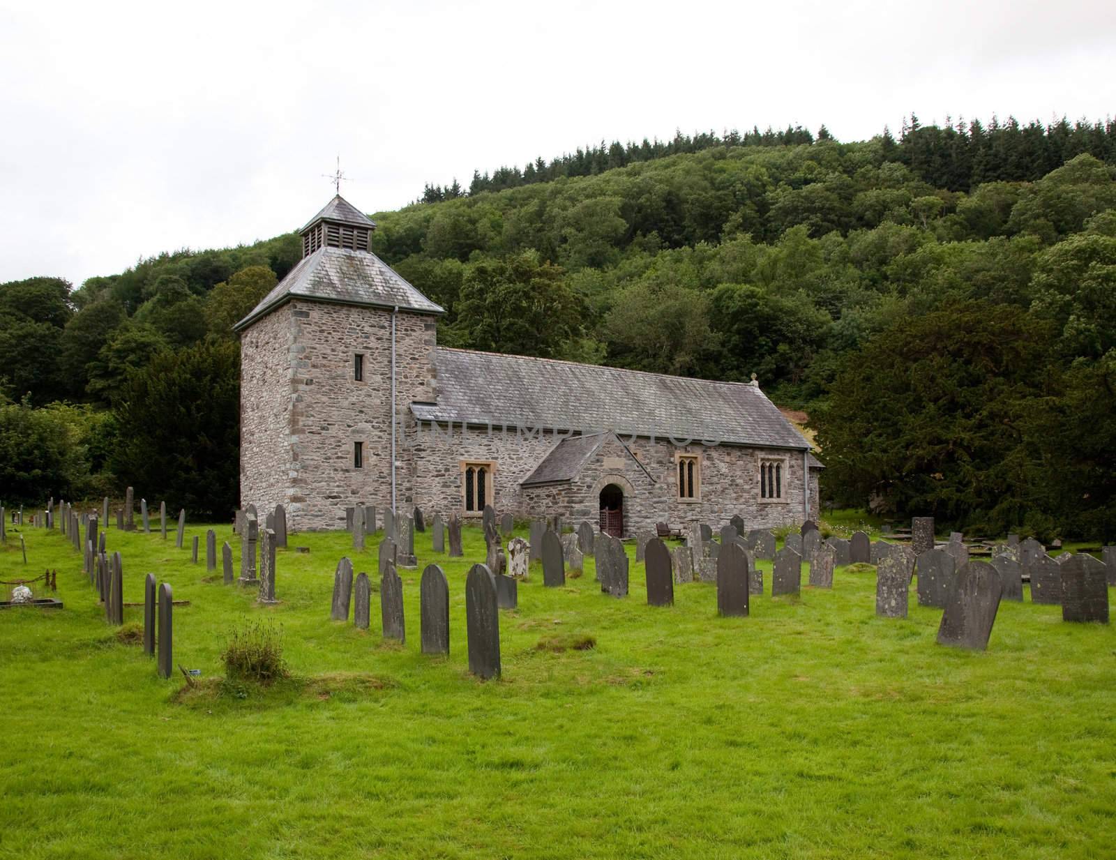 View across Graveyard to old stone church in north Wales