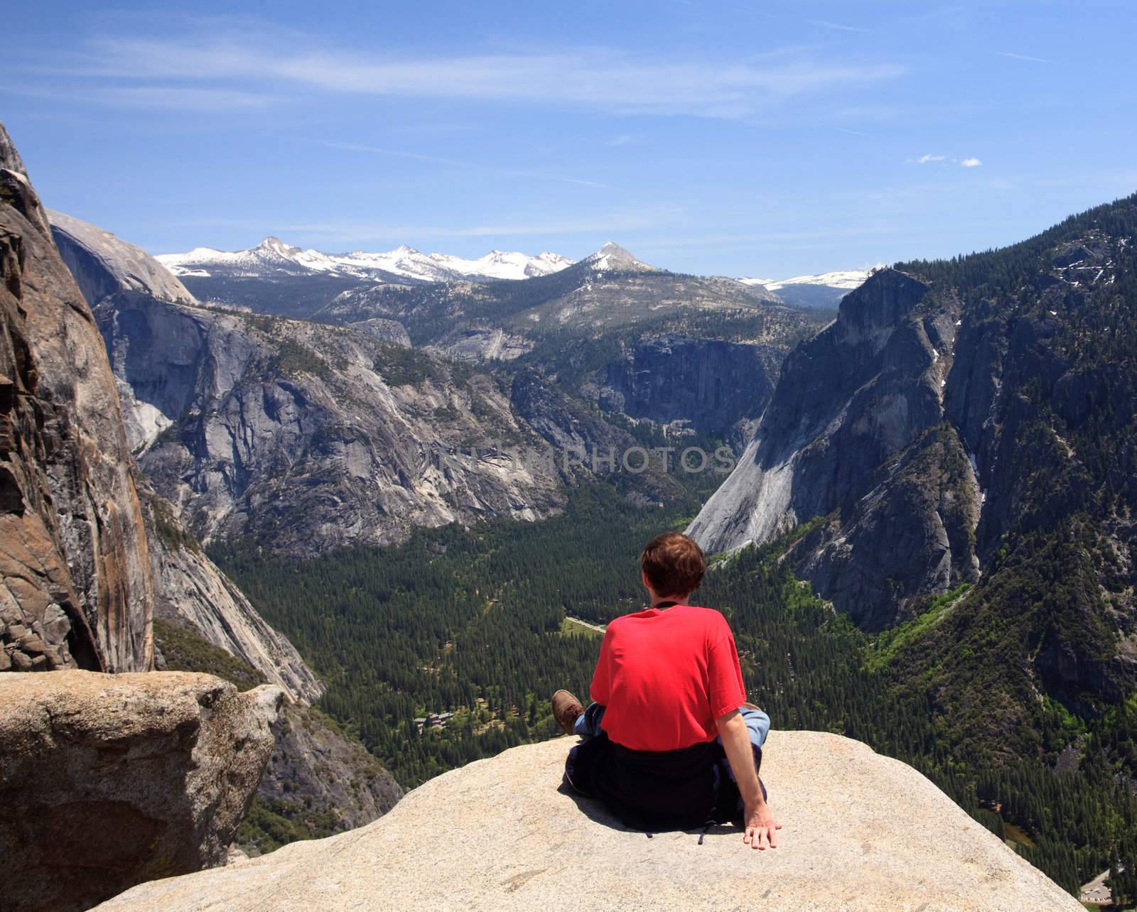 Hiker overlooking Yosemite view by steheap