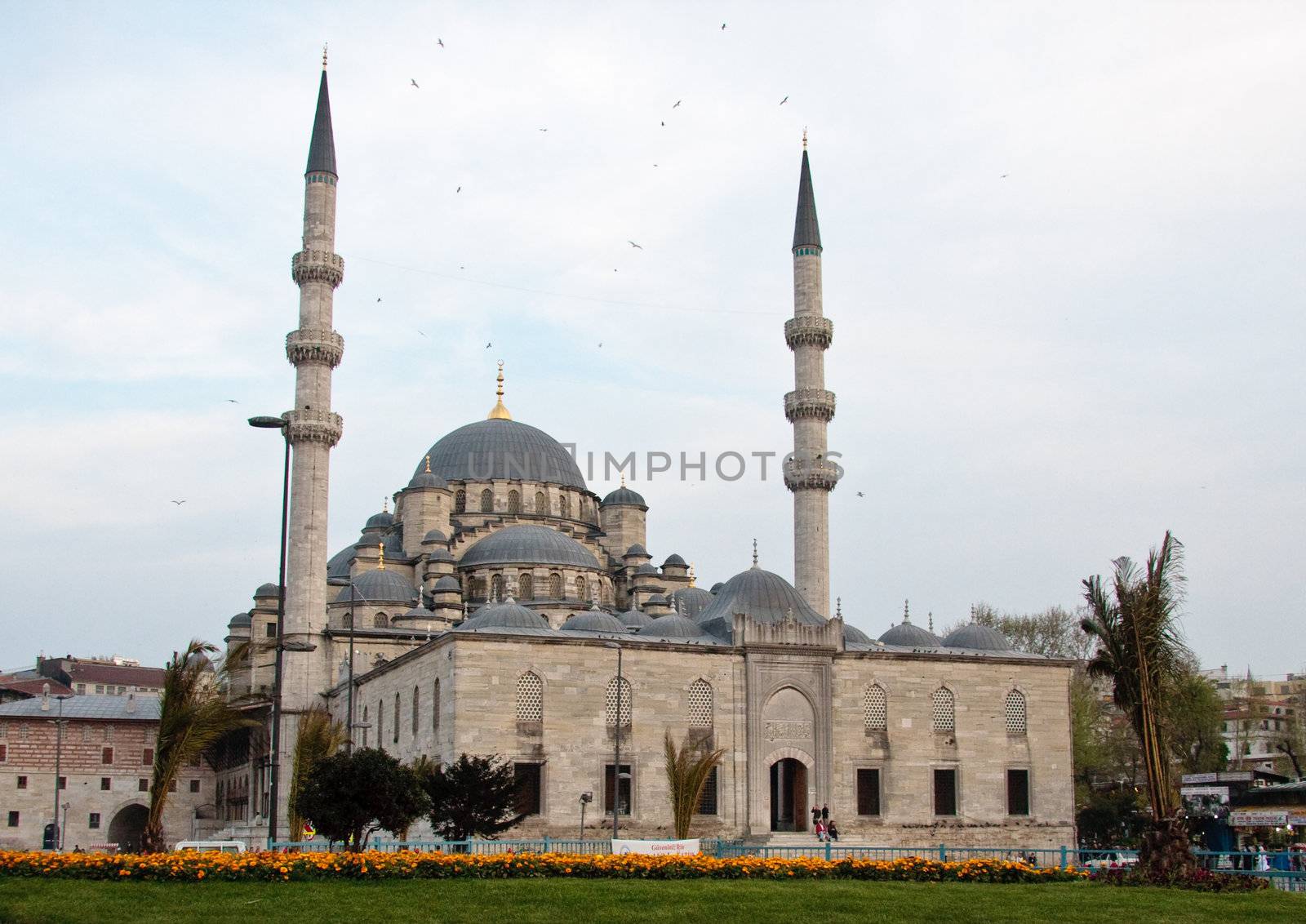 Evening view of the New Mosque by the Galata Bridge in Istanbul, Turkey