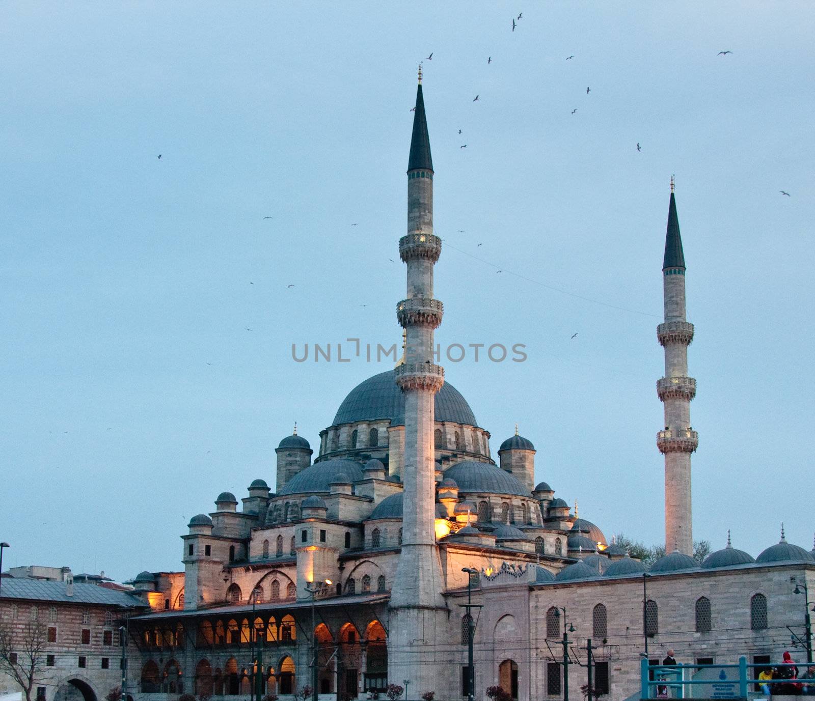 The Mosque of the Valide Sultan or New Mosque in the evening by the Galata Bridge