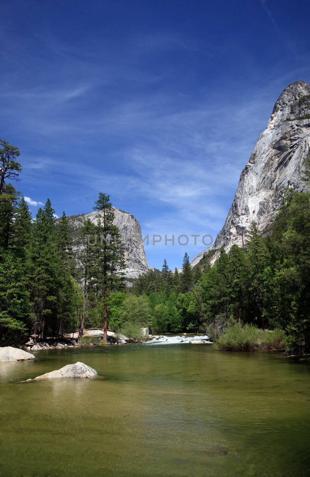 Yosemite valley peaks reflected in the calm water of Mirror lake