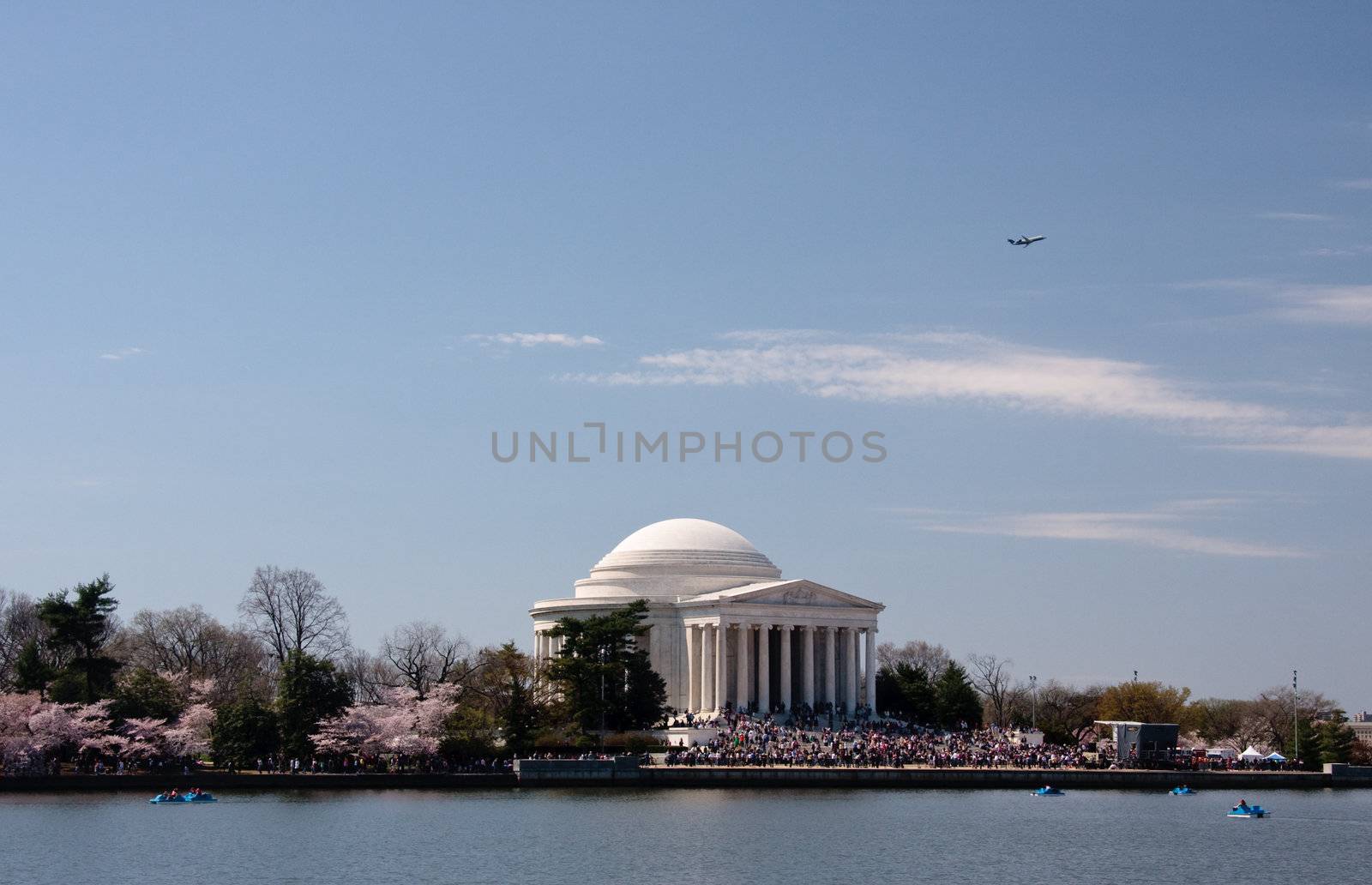 Plane taking off over Jefferson Memorial by steheap