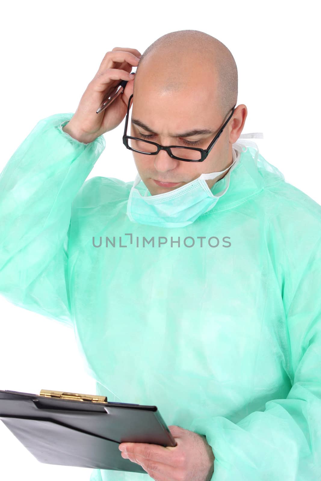 Details an surgeon thinking with documents and pencil