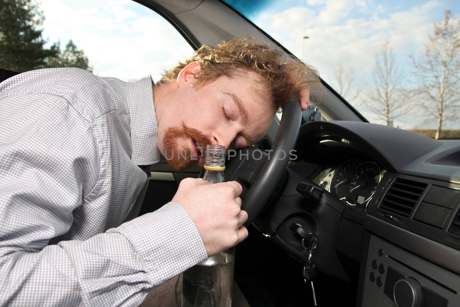tired driver sleeps in a car