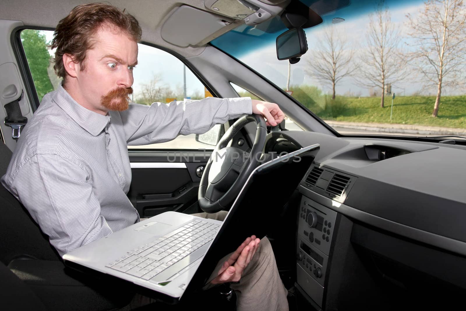 driver using gps laptop computer in a car 
