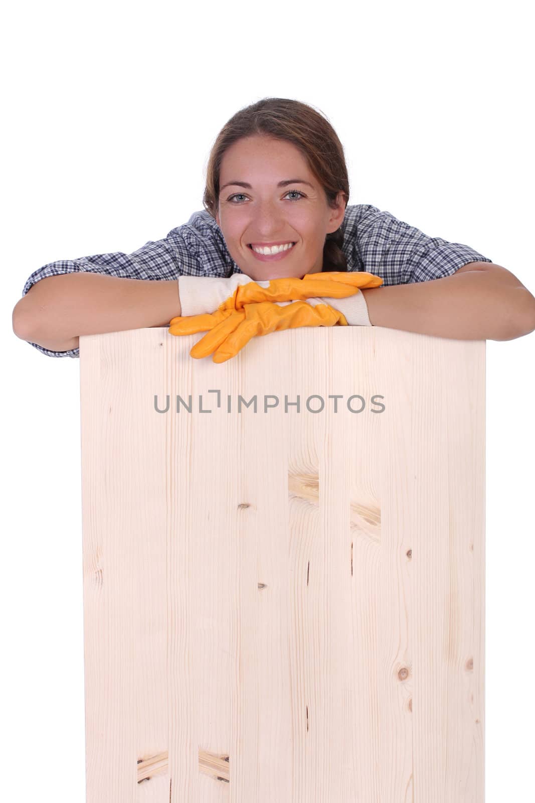 woman carpenter holding wooden plank on white background 
