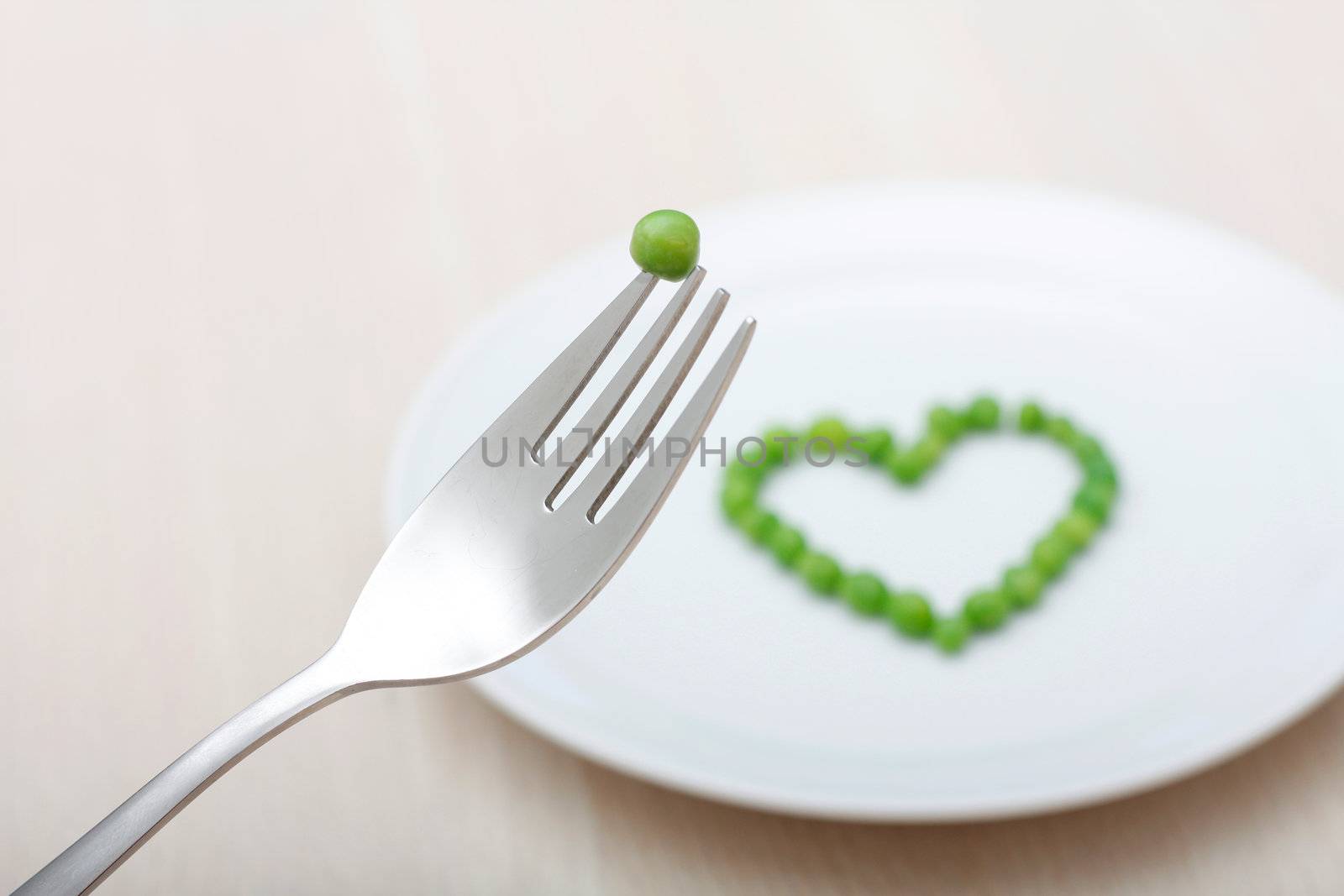 Heartshaped peas on a plate