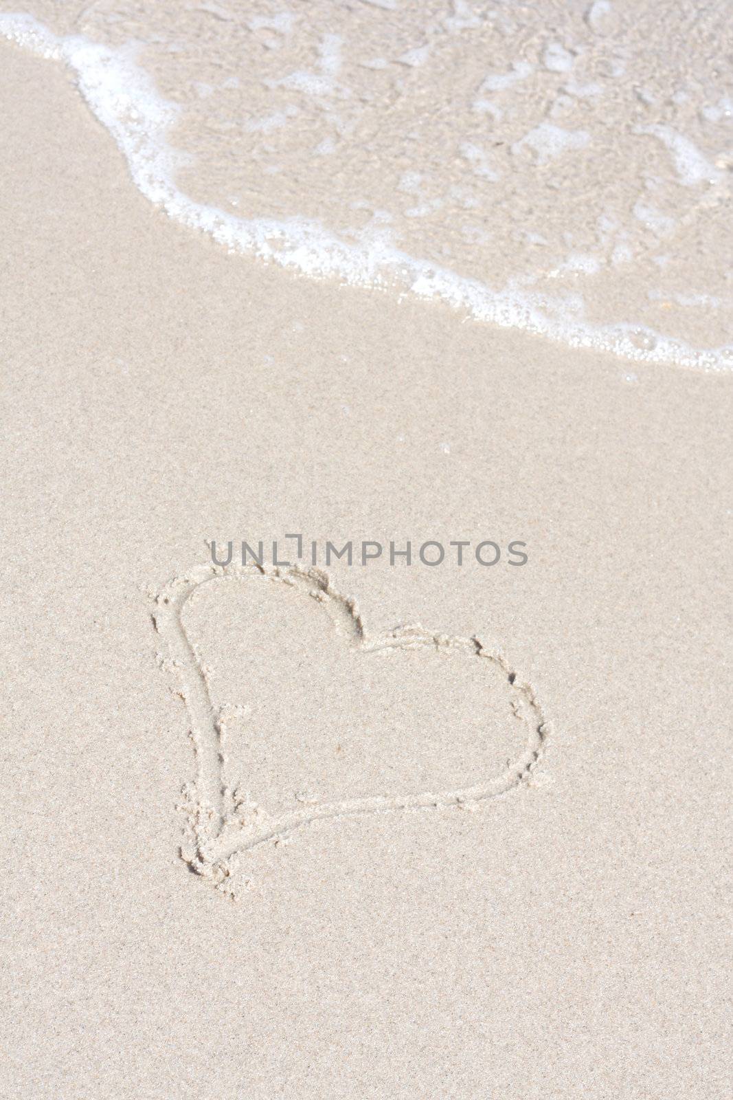A heart symbol on the beach