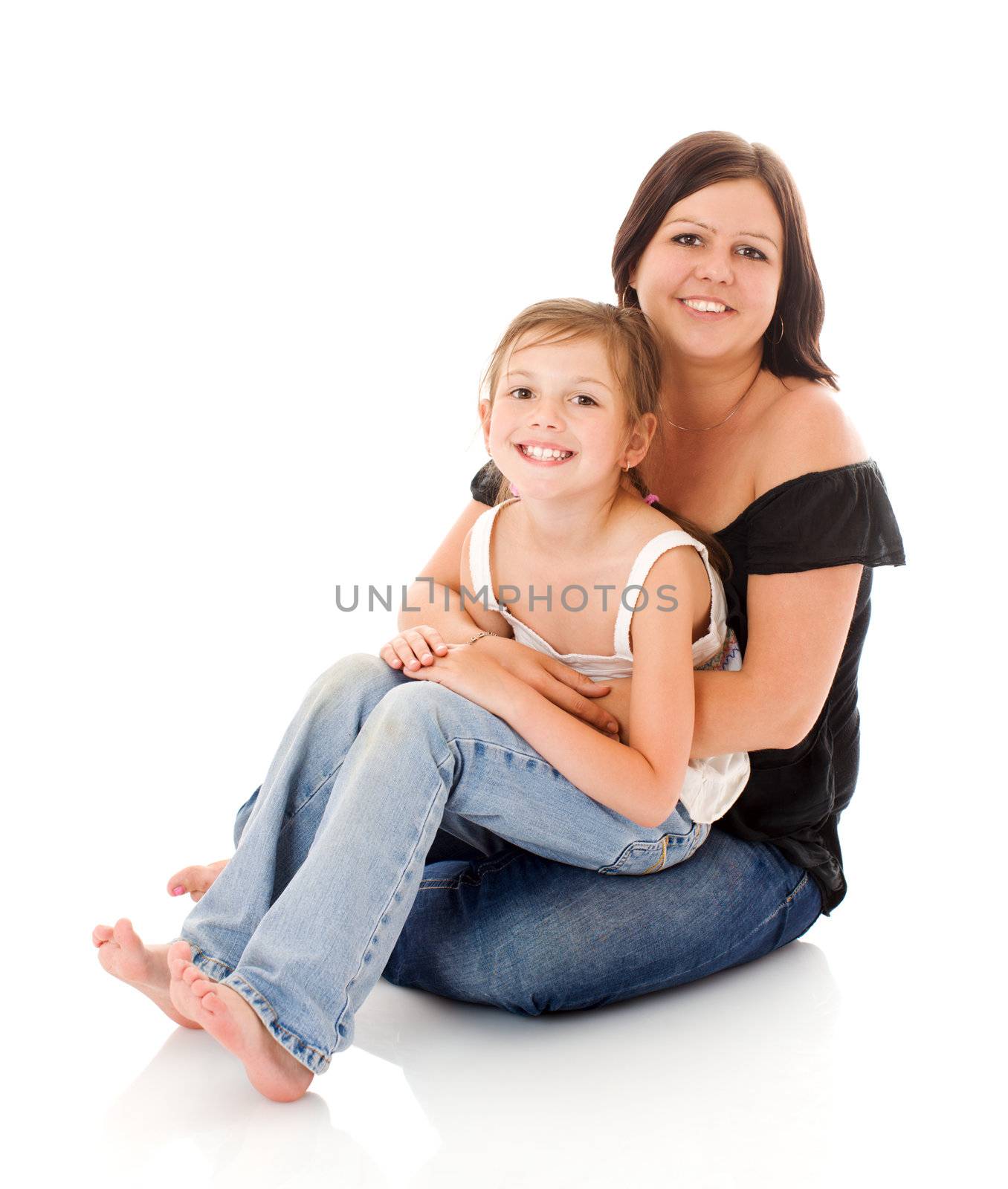 Mother and daughter sitting together isolated on white